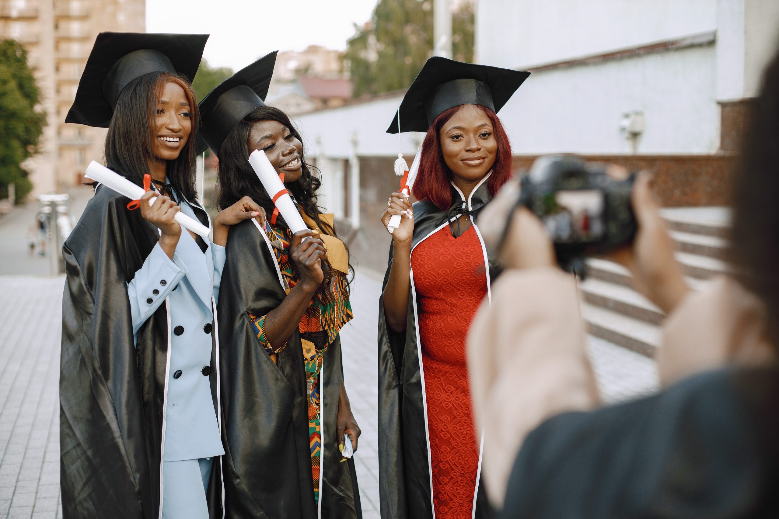 Three african american female students posing for a photo at the Three african american female students posing for a photo at the