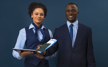 front-view-flight-attendants-with-tablet